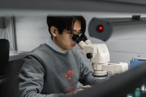 boy-looking-through-microscope