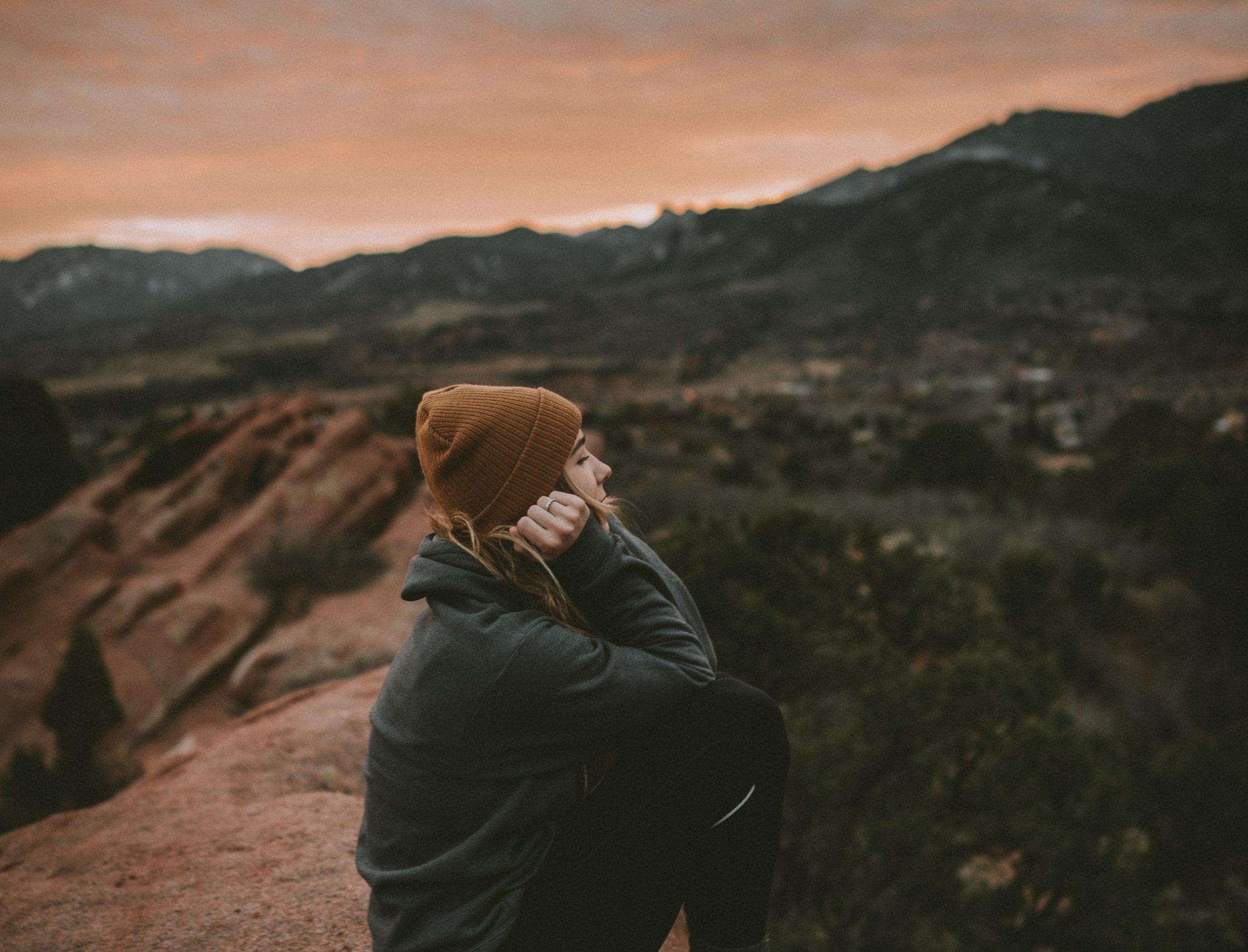 girl sitting on a rock girl sitting on a rock